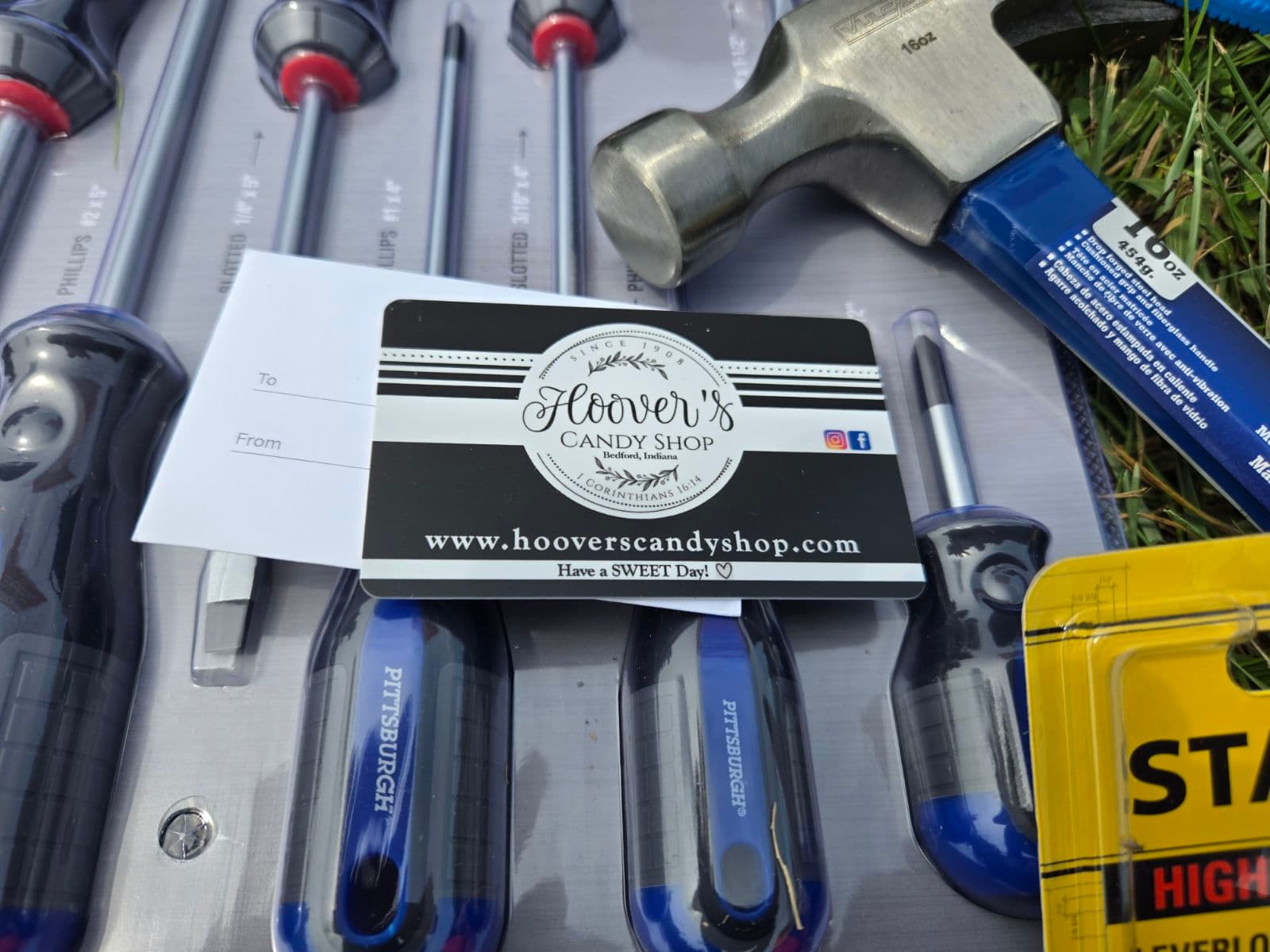 Hoover's Candy Shop gift card sitting on the new screwdriver set and hammer